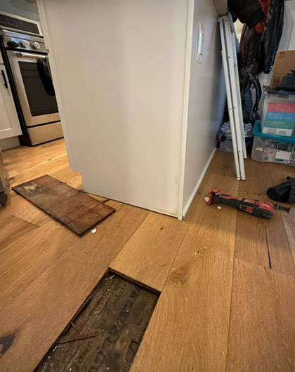 Flooring lifted to check damp subfloor after water damage