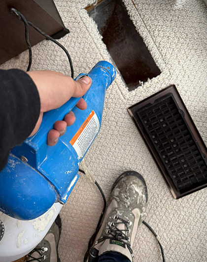 Spray bottle used near floor vent during HVAC mold concern